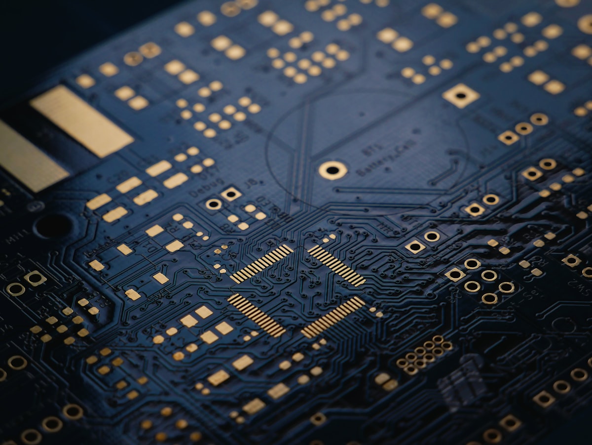 Macro photograph of a circuit board with gold traces