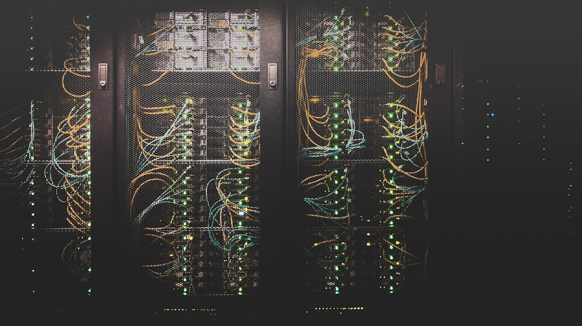 Server racks threaded with fiber cabling in a data center